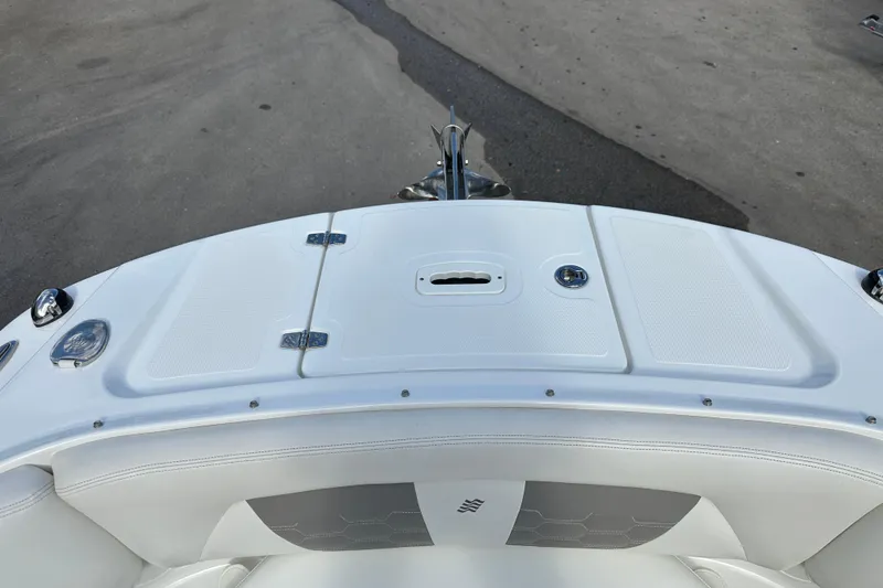 Slide: The Image of 2020 Four Winns HD240 OB boat deck with storage compartments and sleek design. - 18