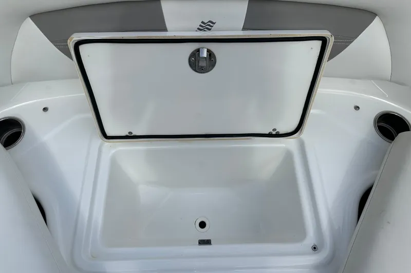 Slide: The Image of Open storage compartment on 2020 Four Winns HD240 OB boat. - 30
