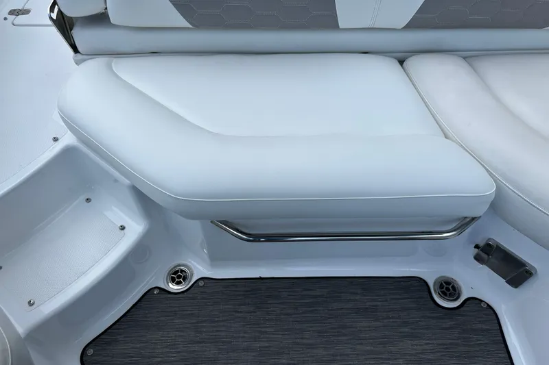 Slide: The Image of 2020 Four Winns HD240 OB boat interior with white cushioned seating. - 49