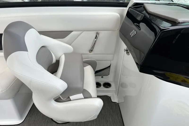 Slide: The Image of 2020 Four Winns HD240 OB boat interior with white and gray seating. - 54