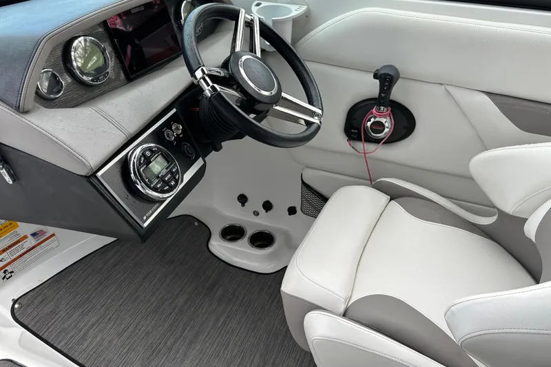 Slide: The Image of 2020 Four Winns HD240 OB boat cockpit with steering wheel and control panel. - 55