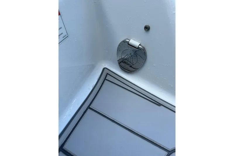 Slide: The Image of 2020 Four Winns HD240 OB boat deck with chrome fixture and non-slip flooring. - 68