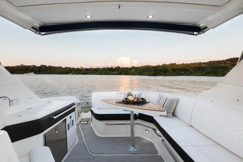 Slide: The Image of Manufacturer Provided Image: 2021 Sea Ray Sundancer 320 interior with lake view and sunset. - 14