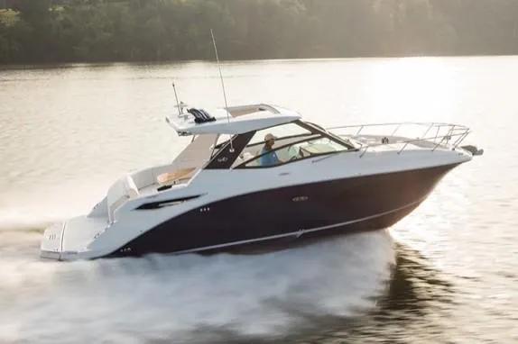 Slide: The Image of Manufacturer Provided Image: 2021 Sea Ray Sundancer 320 cruising on a lake at sunset. - 5