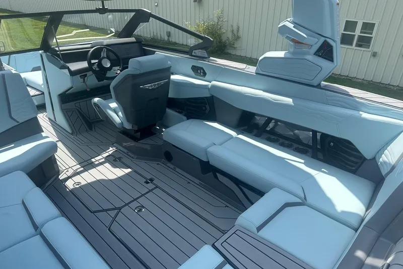 Slide: The Image of 2026 Nautique Super Air Nautique G23 interior with sleek seating and modern dashboard design. - 10