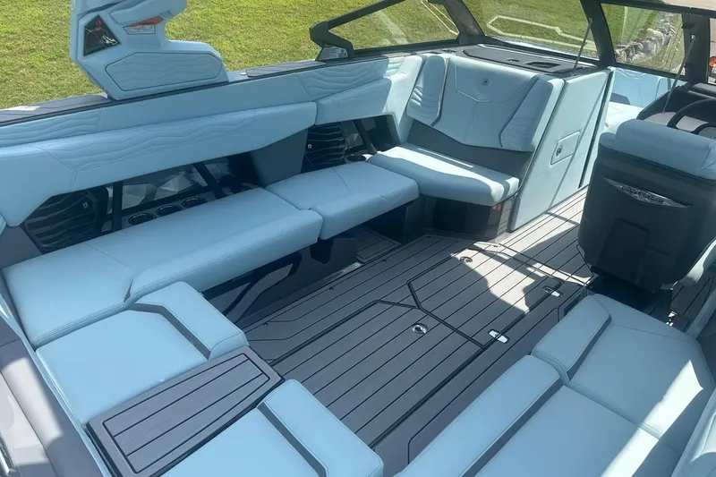 Slide: The Image of 2026 Nautique Super Air Nautique G23 interior with luxurious seating and modern design. - 11