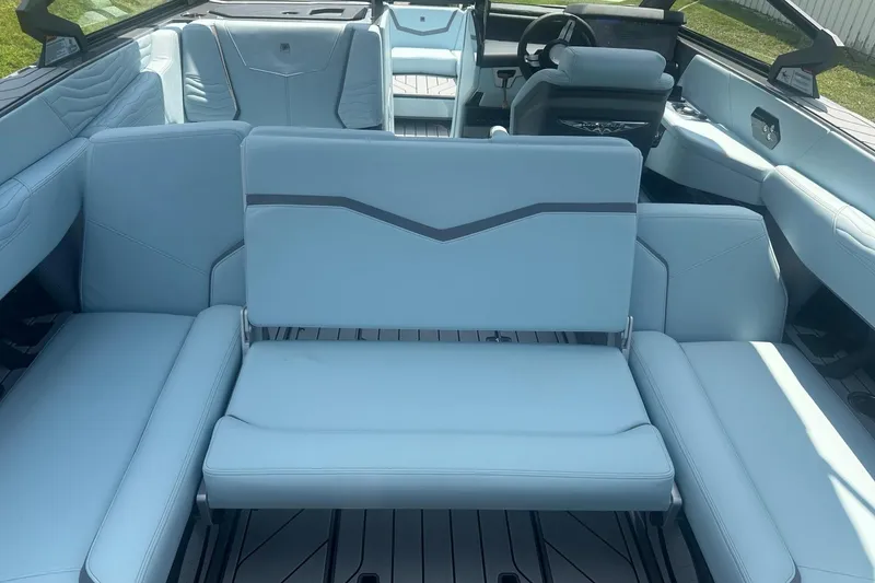 Slide: The Image of 2026 Nautique Super Air Nautique G23 interior with luxurious seating and modern design. - 14