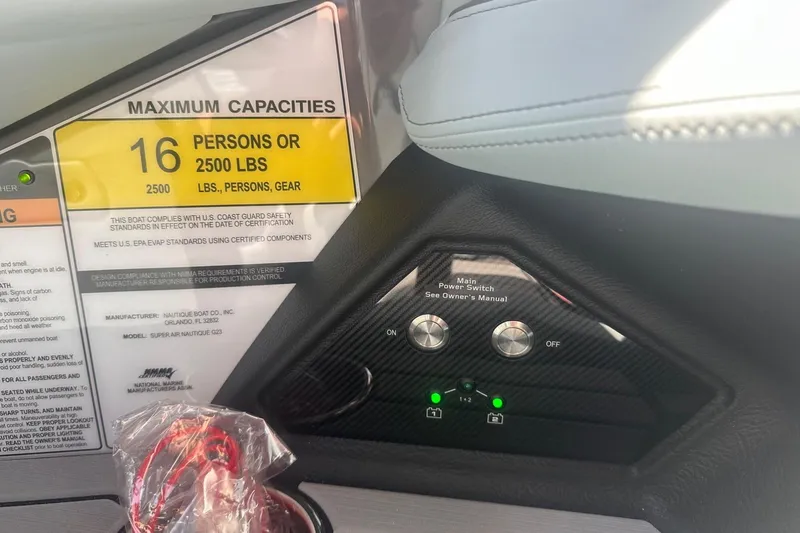 Slide: The Image of 2026 Nautique Super Air Nautique G23 capacity label, 16 persons or 2500 lbs, with control panel. - 20