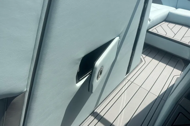 Slide: The Image of 2026 Nautique Super Air Nautique G23 interior detail with sleek upholstery and flooring. - 21