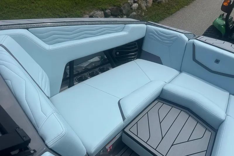 Slide: The Image of 2026 Nautique Super Air Nautique G23 interior with light blue seating and modern design. - 31