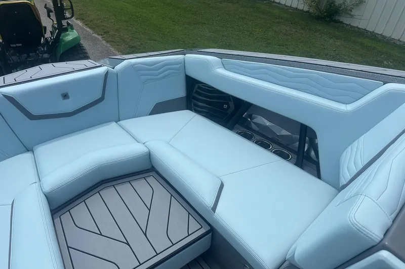 Slide: The Image of Luxurious interior of 2026 Nautique Super Air Nautique G23 boat with light blue seating. - 32