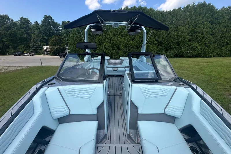 Slide: The Image of 2026 Nautique Super Air Nautique G23 boat interior with light blue seating and sleek design. - 35