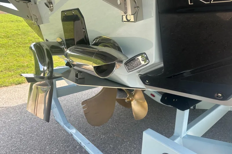 Slide: The Image of 2026 Nautique Super Air Nautique G23 boat propeller and exhaust system close-up. - 37