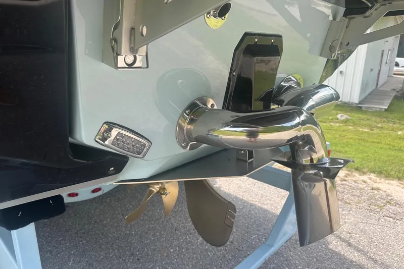 Slide: The Image of 2026 Nautique Super Air Nautique G23 boat stern with propeller and exhaust system. - 38