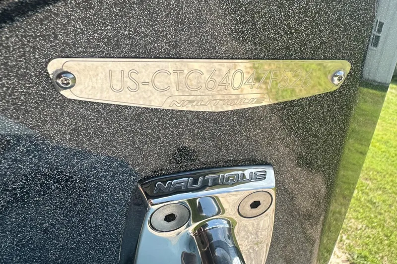 Slide: The Image of 2026 Nautique Super Air Nautique G23 boat identification plate and logo detail. - 42