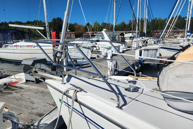 Slide: The Image of Catalina 350 sailboat from 2004 docked at a marina on a sunny day. - 12