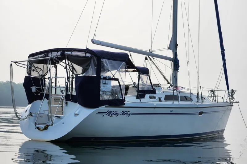 Slide: The Image of Catalina 350 sailboat from 2004 on calm water, featuring a sleek design. - 17
