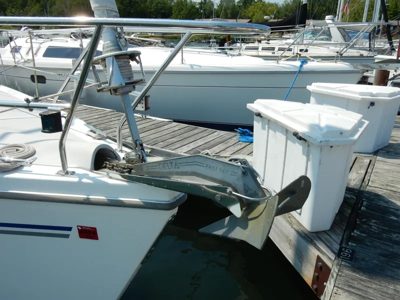 Slide: The Image of Catalina 350 sailboat from 2004 docked, featuring a prominent anchor and deck equipment. - 3