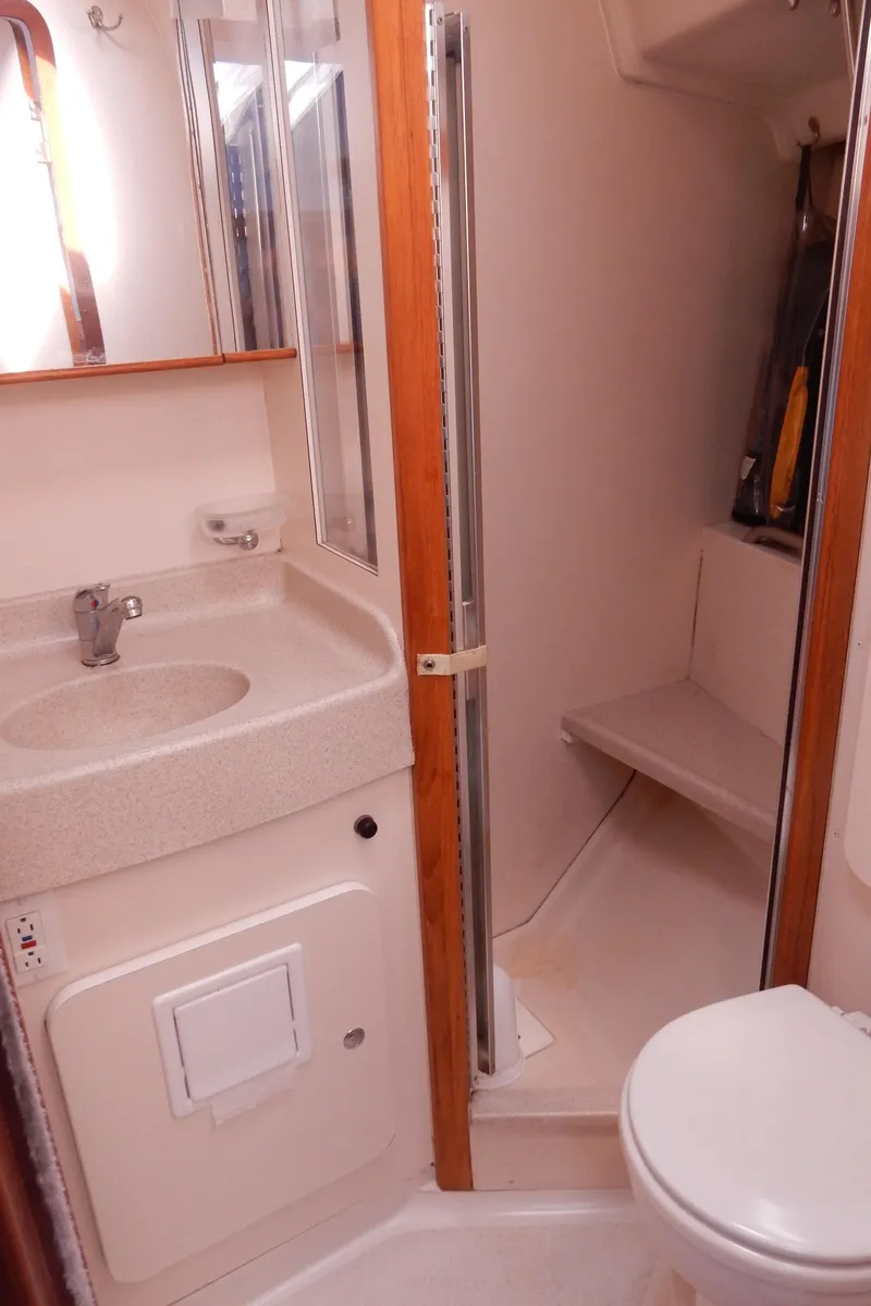 Slide: The Image of 2004 Catalina 350 yacht bathroom with sink, shower, and toilet. - 40