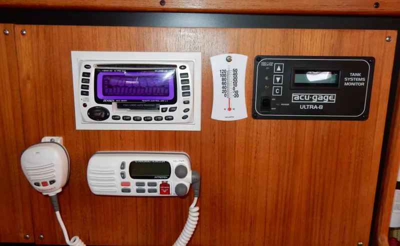 Slide: The Image of Control panel of a 2004 Catalina 350 boat with radio and monitoring systems. - 45