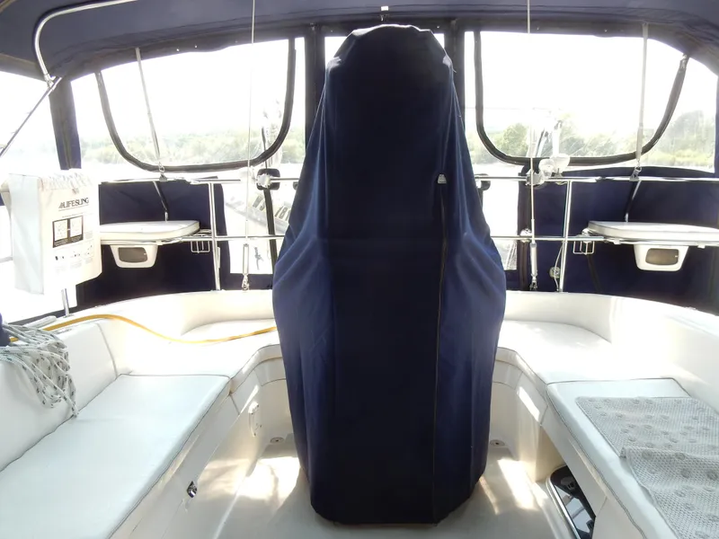 Slide: The Image of Interior of a 2004 Catalina 350 sailboat cockpit with covered helm and seating. - 47