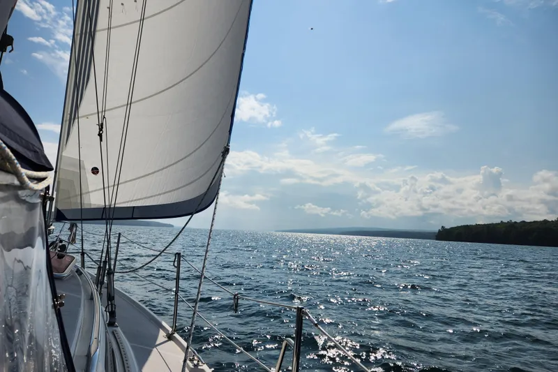 Slide: The Image of Sailing on a 2004 Catalina 350 yacht under clear skies on a sparkling lake. - 79