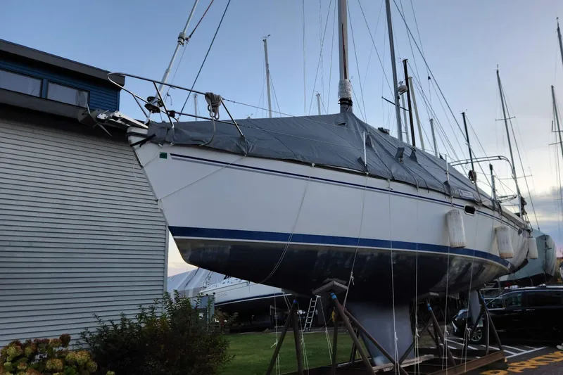 Slide: The Image of 2004 Catalina 350 sailboat in dry dock, covered and secured for storage. - 81