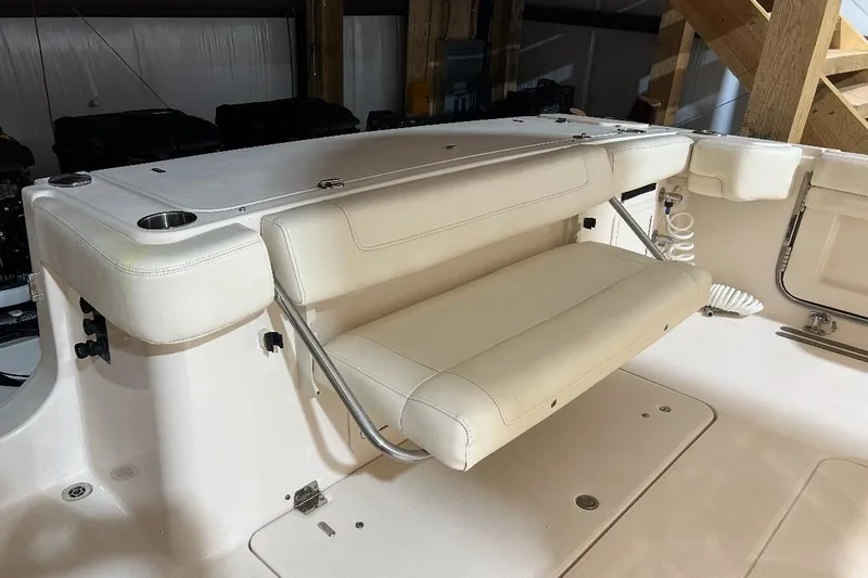 Slide: The Image of 2019 Grady-White Canyon 336 boat interior with foldable seating and cup holders. - 18