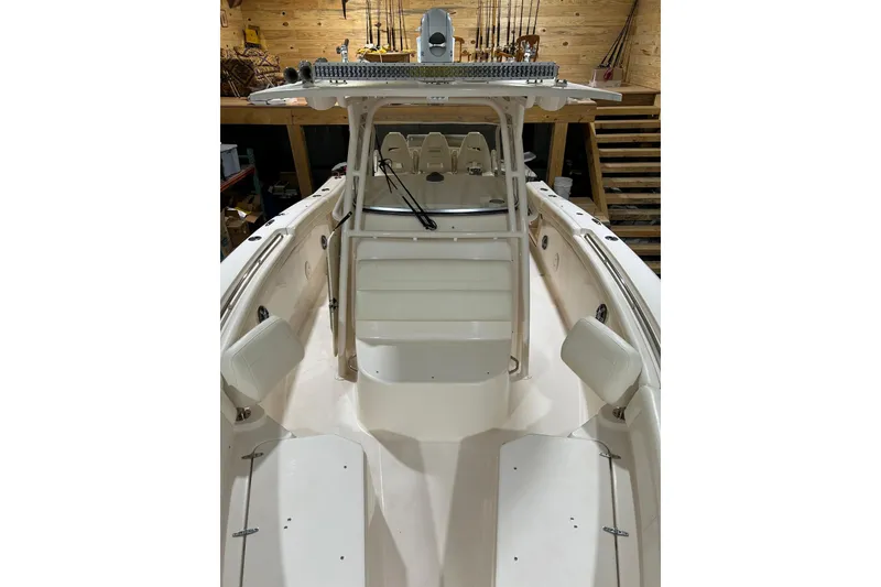 Slide: The Image of 2019 Grady-White Canyon 336 boat interior with seating and fishing equipment. - 2