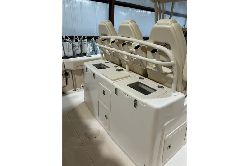 Slide: The Image of 2019 Grady-White Canyon 336 boat interior with seating and storage compartments. - 7