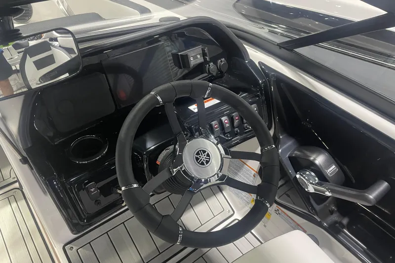 Slide: The Image of 2025 Yamaha Boats 195S cockpit with steering wheel and control panel. - 6
