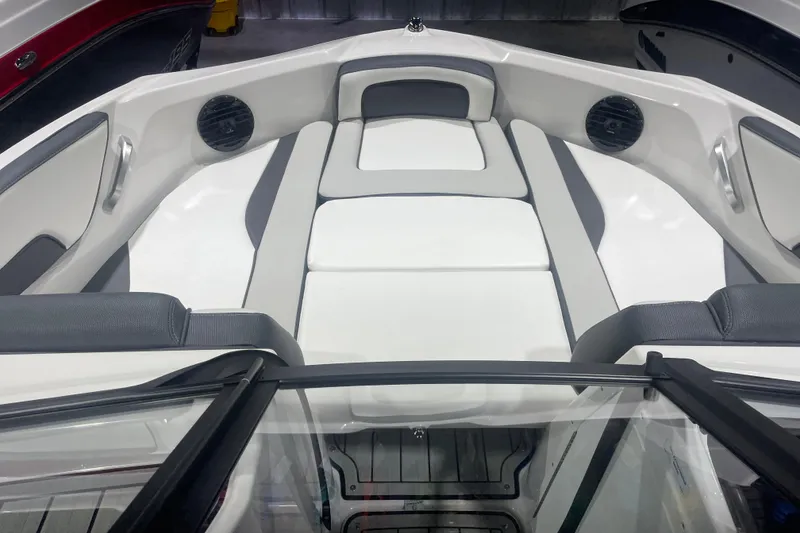 Slide: The Image of 2025 Yamaha Boats 195S interior with sleek white seating and modern design. - 7