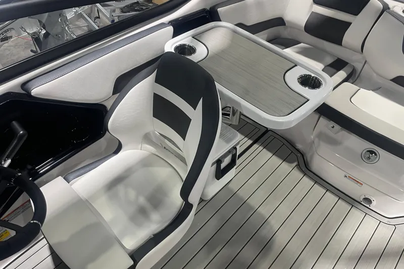 Slide: The Image of 2025 Yamaha Boats 195S interior with sleek seating and modern table design. - 8