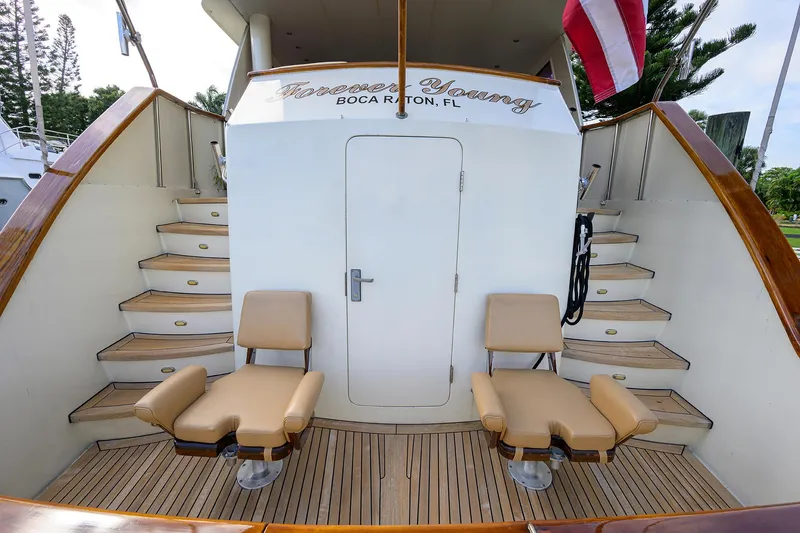 Slide: The Image of 1991 Hatteras 78 CMY yacht deck with seating and stairs, Boca Raton, Florida. - 11