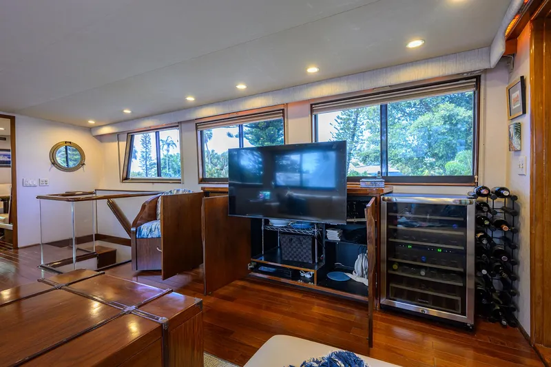 Slide: The Image of Luxurious interior of 1991 Hatteras 78 CMY yacht with TV and wine cooler. - 22