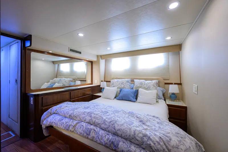 Slide: The Image of Luxurious bedroom interior of 1991 Hatteras 78 CMY yacht with cozy bedding and elegant decor. - 36