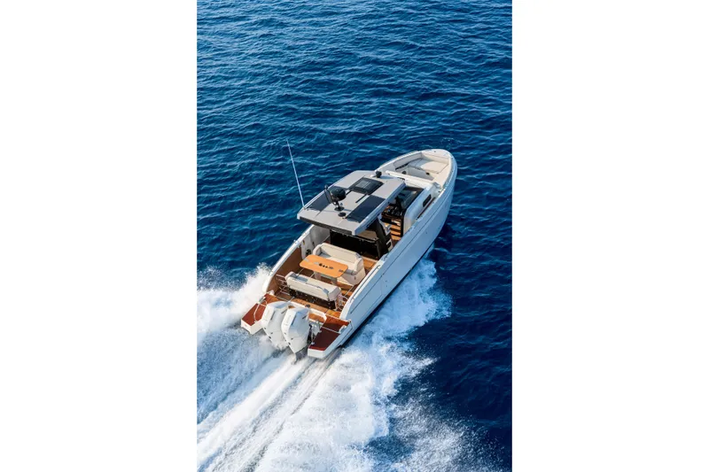 Slide: The Image of 2026 Beneteau Gran Turismo 35 cruising on open blue sea. - 5