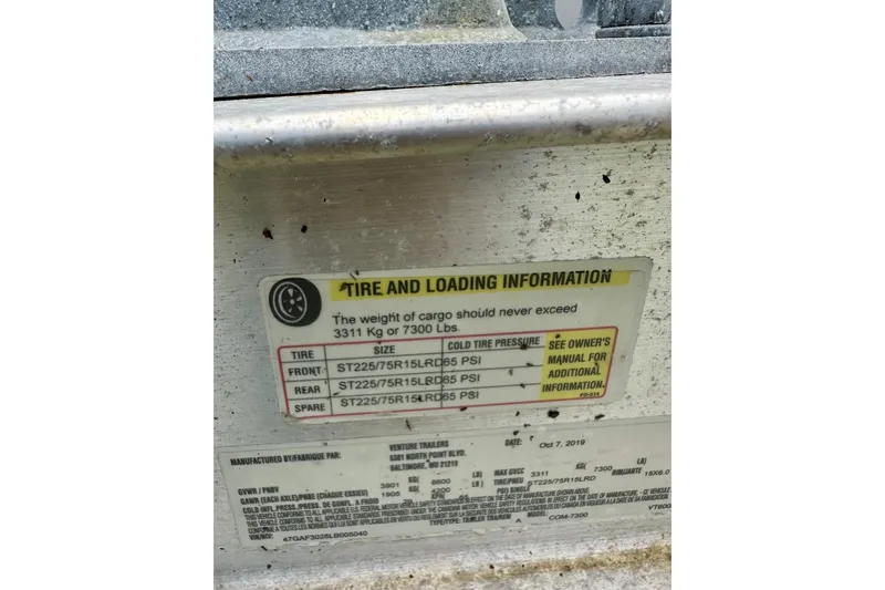 Slide: The Image of Tire and loading information label on Parker 2501 Center Console, 2007 model. - 14