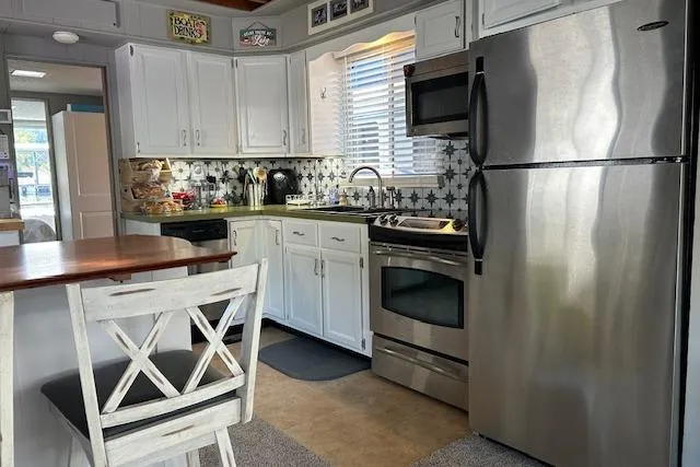 Slide: The Image of Inflatable hot tub on 1987 Somerset Houseboat 14X60 deck, near sliding glass doors. - 18