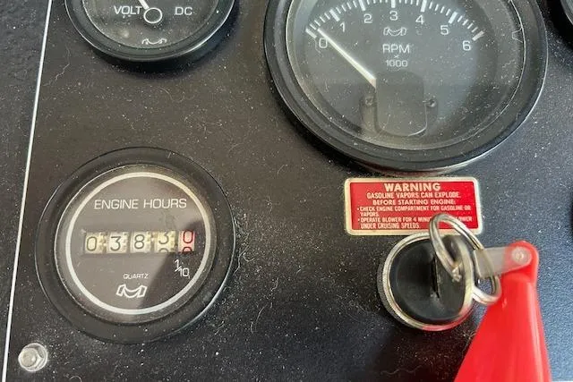 Slide: The Image of Mini fridge stocked with beverages, under a wooden countertop in a Sumerset 14x60, 1987 model. - 22