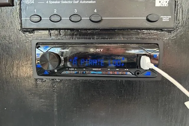 Slide: The Image of Cozy 1987 Somerset Houseboat interior with TV, fireplace, and dining area. - 23