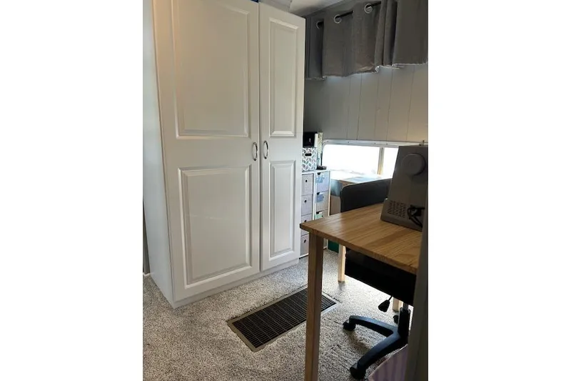 Slide: The Image of Control panel of a 1987 Somerset Houseboat, showing engine hours and RPM gauges. - 25