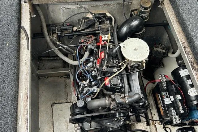 Slide: The Image of Cozy workspace in 1987 Somerset Houseboat with desk, chair, and storage cabinet. - 28