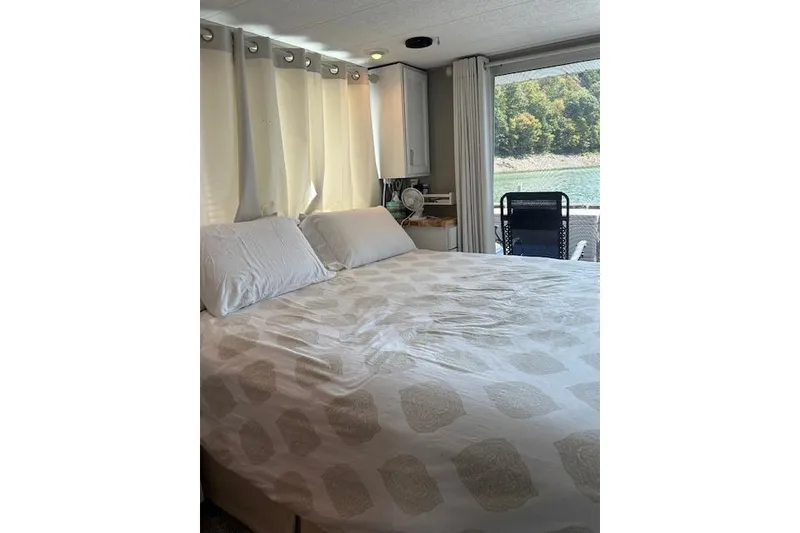 Slide: The Image of Engine compartment of a 1987 Somerset Houseboat 14X60, showing detailed mechanical components. - 30