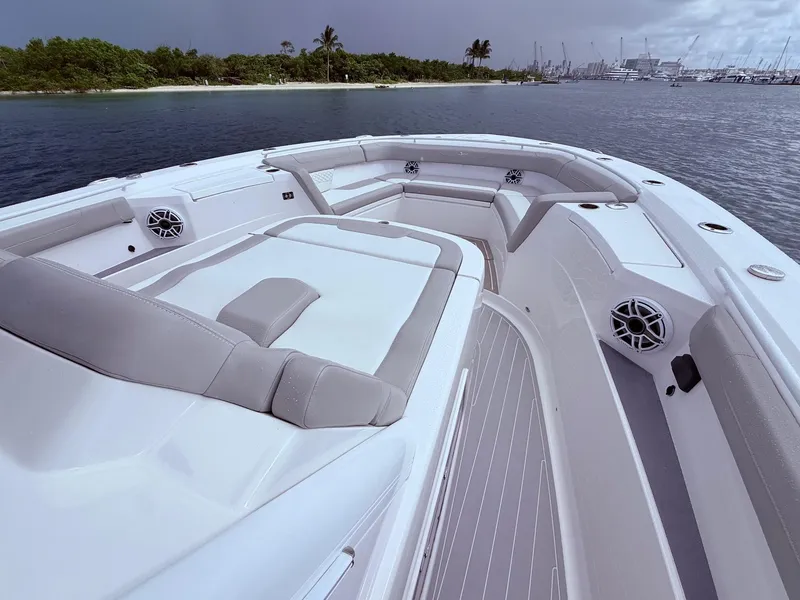 Slide: The Image of 2024 Scout 400 LXF boat interior with luxurious seating and ocean view. - 29