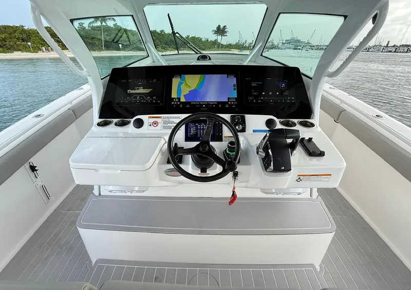 Slide: The Image of 2024 Scout 400 LXF boat helm with advanced navigation system and sleek design. - 35