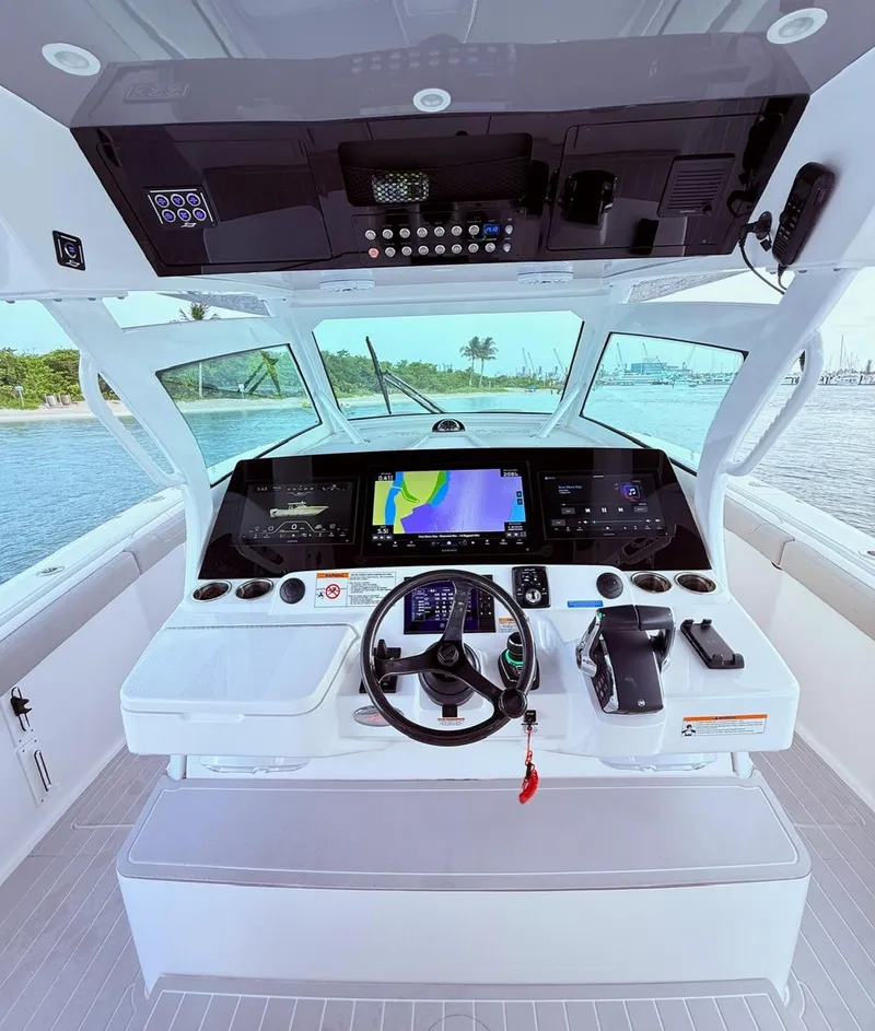 Slide: The Image of 2024 Scout 400 LXF boat helm with advanced navigation displays and controls. - 36