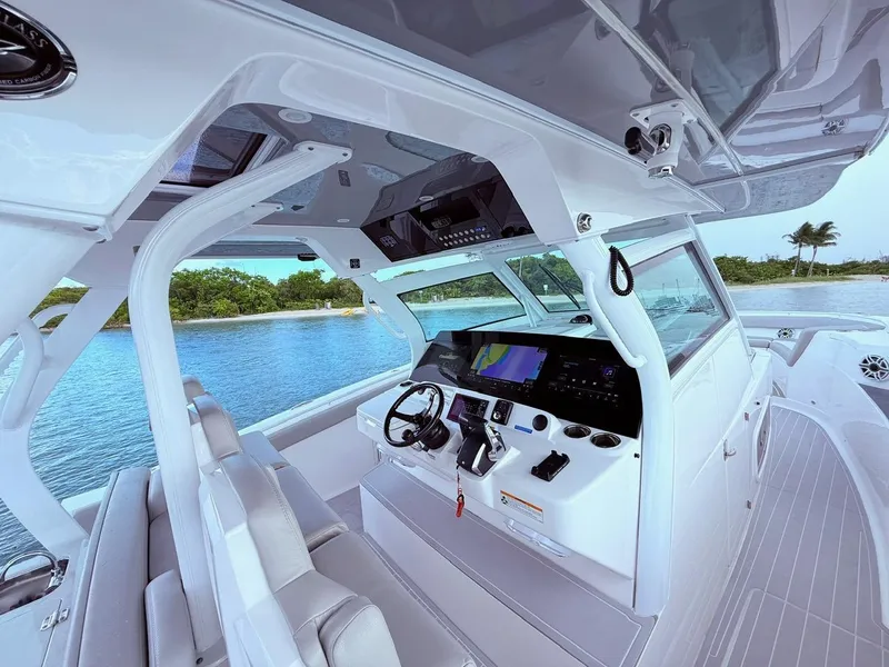 Slide: The Image of 2024 Scout 400 LXF boat interior with advanced navigation system and luxurious seating. - 38
