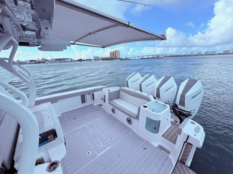 Slide: The Image of 2024 Scout 400 LXF boat with Mercury engines on a calm sea. - 45