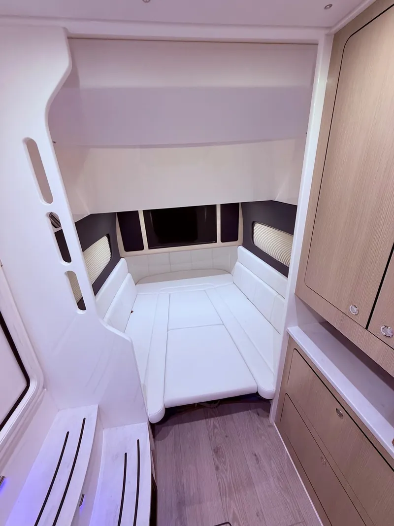 Slide: The Image of 2024 Scout 400 LXF cabin interior with modern seating and cabinetry. - 47